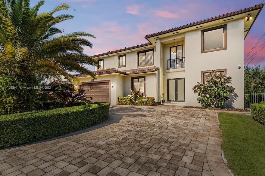 Stunning 2-story custom-built 4 bdrm/ 4 bath home in Palmetto Bay. Volume ceilings, marble & wood flooring and lots of natural light throughout. Open kitchen with large island, dark wood cabinetry, quartz counter tops and stainless-steel appliances. Spacious formal areas, family room and breakfast area with sunny garden view. Wine cooler and bar, perfect for entertaining. Upstairs is the private master suite with seating area, spacious walk-in closets and a loft--ideal for home office space.  Hurricane impact windows and doors. Screened patio with slate flooring plus outdoor kitchen. Indoor laundry, 2 car garage. Prime location, walk to Coral Reef Park.