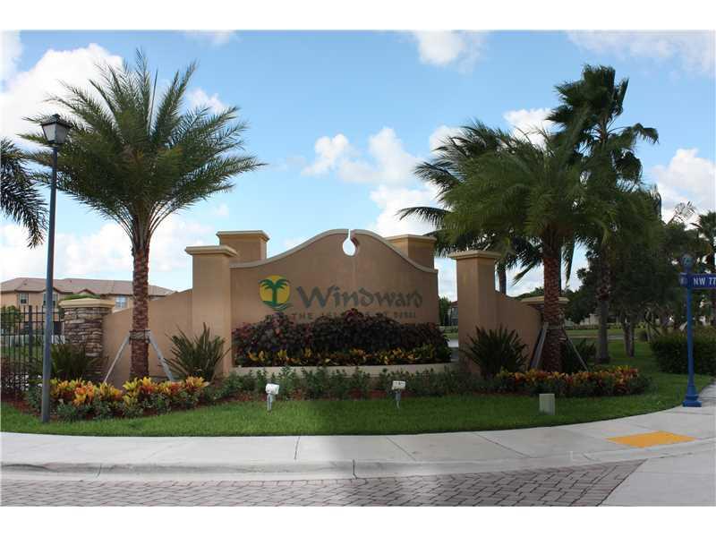 BEAUTIFUL 4 BEDROOMS AND 2.5 BATHROOMS TOWNHOME AT ISLANDS AT DORAL, WINDWARD. OVER 2,000 SQ. FT. VERY WELL DISTRIBUTED ON TWO FLOORS. MANY UPGRADES, NICE FENCED PATIO FACING THE LAKE. EXCELLENT GATED COMMUNITY WITH A CHOICE OF A+ SCHOOLS NEARBY. LOTS OF AMENITIES!!