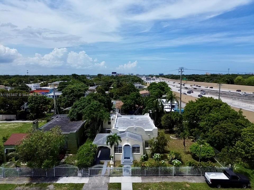 Step into this completely renovated Miami home just minutes from Wynwood and the Design District. Sun-filled living areas blend timeless character—arched openings, original trim—with fresh quartz countertops, stainless appliances, and updated plumbing and electric. A deep, fully fenced yard invites Sunday barbecues, future-pool dreams, or pets that love to run. Need extra space? The detached studio/ADU is ready for guests, office, or creative pursuits, and the covered carport keeps you dry on rainy days. Quiet street, no HOA, and quick access to Brightline & I-95. Located in a federally designated Opportunity Zone—ask how this could boost long-term returns. Call the listing agent for full details and a private tour!