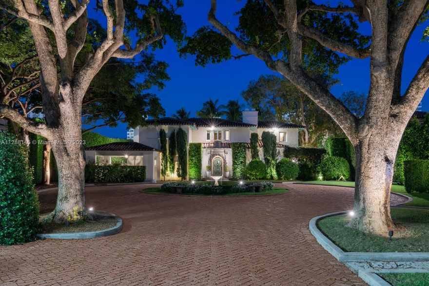 Magnificent waterfront estate with Mediterranean architecture by famous architect, Carlos Schoeppl! Located on prestigious Flamingo Drive, the secluded 32,000-sf property has an impressive estate entrance leading to the main house. The expansive living areas feature stunning original details, high ceilings, fireplace, media room, marble gourmet kitchen, formal dining. Huge master bedroom with modern bath, walk-in closets, & terrace overlooking the water. 5 beds up, 2 beds down, 2 detached guest-suites. Outside, idyllic porches surrounded with flourishing vegetations, corral stone waterwall, huge pool with spa, dock with a boatlift, 100-FT of WF