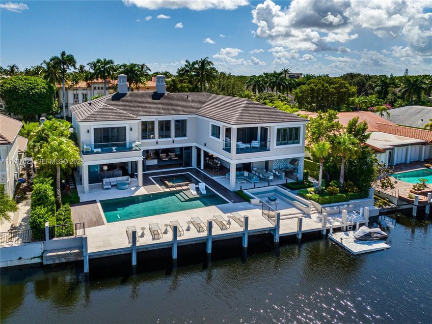 Be the first to live in this newly and fully renovated contemporary two-story home, featuring over 100 feet of prime waterfront living. The Sanctuary, distinguishes itself as one of the most private and secure luxury waterfront community in South Florida including intracoastal access, 24/7 gate security, water patrol, and private roads. This newly built residence boasts a bright and cheerful Southern Exposure, bathing the home in natural light. As you enter, you'll be captivated by the soaring 30 ft ceilings opening up to the living room overlooking the pool and the waterfront covered patio. The first floor features an office and dining room, wine and bar areas, an open kitchen with center island, and the second floor features the master bedroom suite with a fitness room & a steam shower.