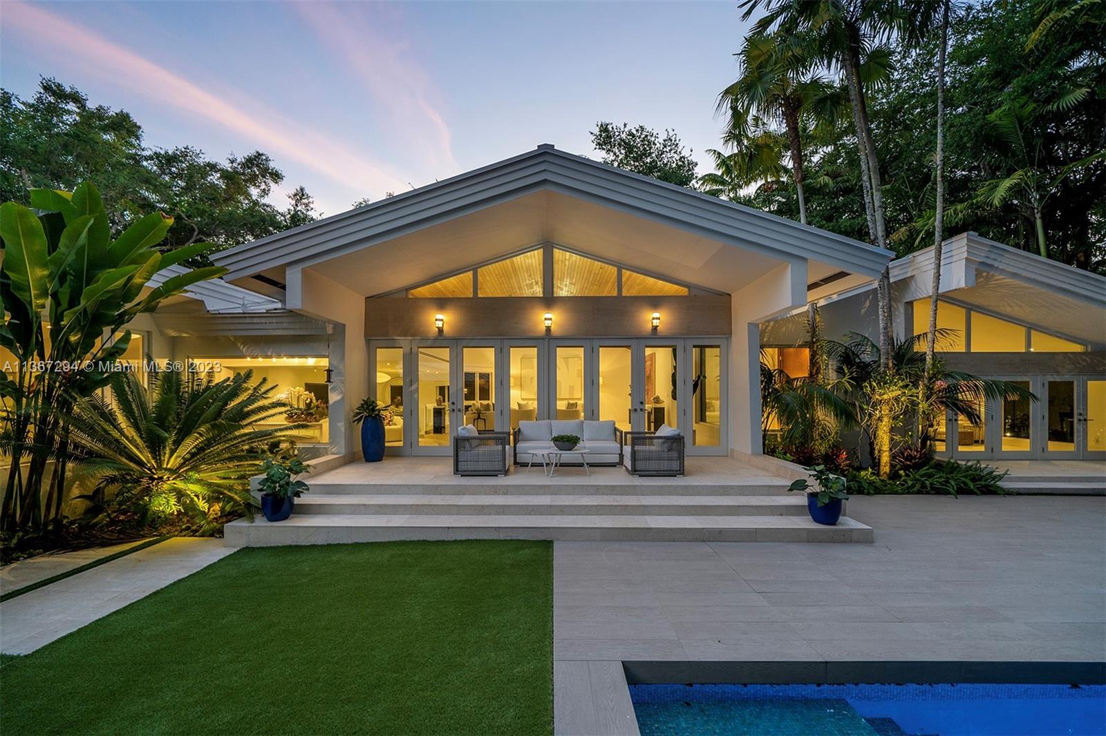 Nestled within a tropical paradise in N Pinecrest, discover an awe-inspiring 1-story estate situated on an expansive 42,253 sf lot enveloped in lush vegetation. The stunning flrplan features a chef's kitchen equipped w/Bulthaup cabinets, sleek stainless-steel countertops, Subzero appl & a Gaggenau electric oven. The spacious living areas provide breathtaking views of the tropical oasis, perfect for relaxation & rejuvenation. Indulge in the grand master suite, adorned w/a welcoming sitting area, a spa-like bath w/floating tub, outdr courtyd, & private access to the exquisite pool & patio area surrounded by captivating palm trees, charming gardens, & pebbled pathways. Add’l features: full house generator, polished French limestone, light wood flrs, 2-car gar & elite Pinecrest schools nearby.