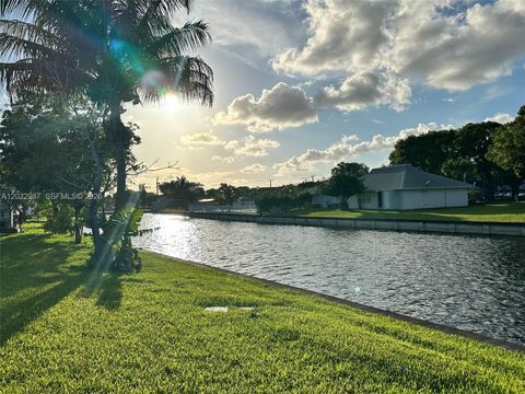 Photo of 8309 NW 59th Pl, Tamarac, FL 33321 (MLS # A12022987)