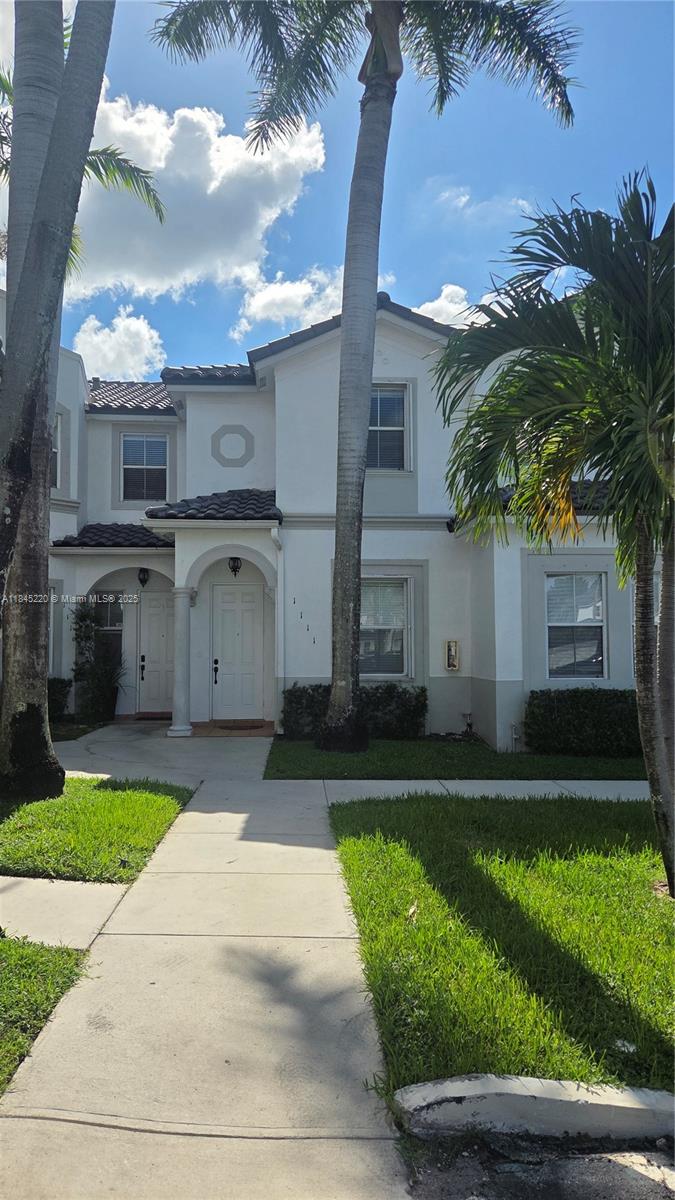 Prime location in Doral, 2 Bedrooms, 2.5 Bathrooms Townhome. First floor with porcelain tile, second floor with laminate flooring. Granite countertops in the kitchen. Closets with built-in cabinetry, upstairs laundry. New Fence. The HOA provides a gated entry, security patrol, playground and a community pool, close to supermarkets and restaurant.