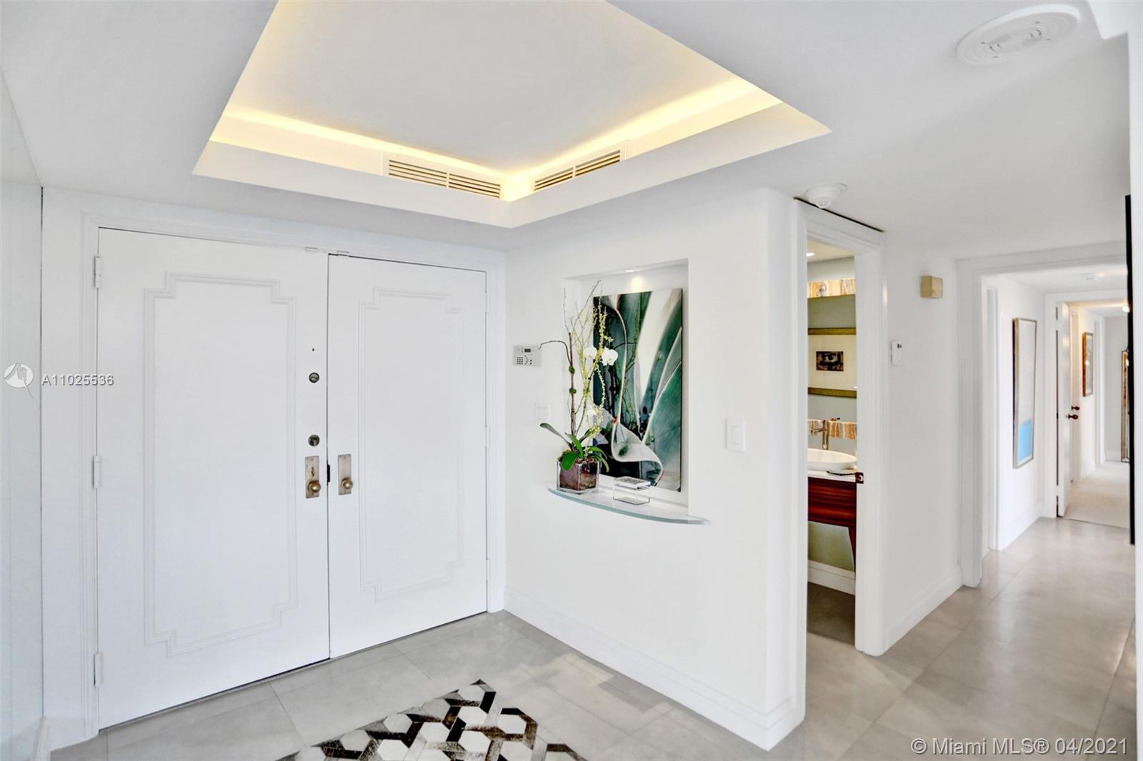 Exquisitely remodeled, this contemporary Grove Isle home is timeless. Situated at the southwest corner of the building, enjoy beautiful Downtown Coconut Grove, Biscayne bay, marina, and lush tropical landscape views. This incredibly spacious residence offers 3 bedrooms, 2.5 bathrooms, 2,424 interior Sq. Ft. and 2 large terraces. Upon entering, you are greeted with neutral colors, clean lines and a simplistic design which offers a comfortable atmosphere. Great for entertaining, the stunning kitchen is open to the living spaces with a suite of high-end stainless-steel appliances, reflective mosaic backsplash, beautiful marble countertops, custom lighting and lots of storage. The sizable master suite has a large his/her walk-in closet, en-suite bathroom and access to its own private terrace