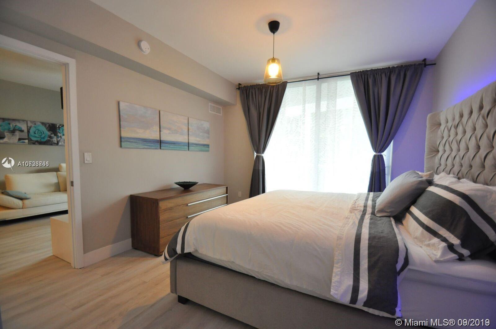 Beautiful FULLY FURNISHED apartment 1 Bed + Den with a private elevator in Aria On The Bay at an amazing price!!! This spectacular apartment has already converted the Den into a second bedroom. 
Gorgeous building with amazing amenities that include sunrise/sunset pool, jacuzzi, spa, gym, movie theater, game room, kids club house, concierge service 24/7,conference area, BBQ area, summer kitchen style and many more. Easy to show.