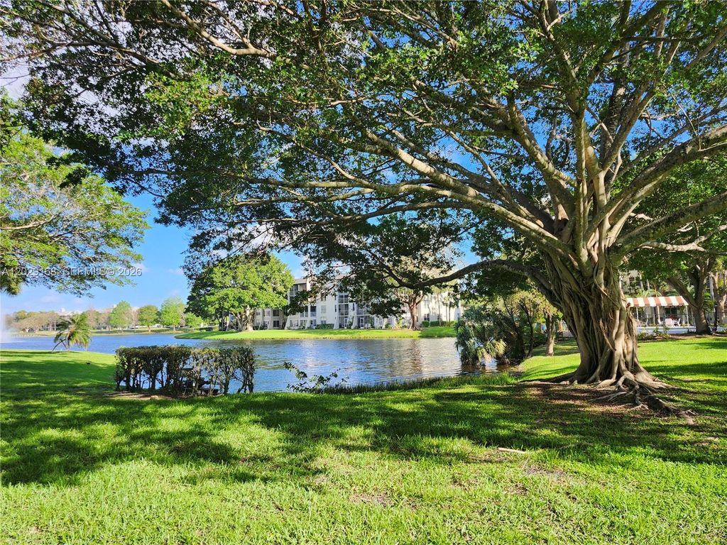 Photo of 9410 Poinciana Pl #101, Davie, FL 33324 (MLS # A12029168)
