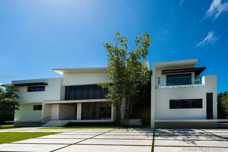 Luxurious Modern Home! At more than 10,000 sq ft this 7 bedroom, 8.5 bathroom home sits on an acre lot in the prestigious Ponce Davis neighborhood. Features include a 3 car garage w/ space for 3 lifts, state-of-the-art appliances, stunning wood and limestone floors, 2 laundry rooms, elevator, gorgeous outdoor kitchen, wine cellar, infinity pool, security cameras, smart home automation, large master suite, and many more. Within close proximity to the top schools, tropical parks, and many local hotspots. Sales associate is an affiliate of seller.