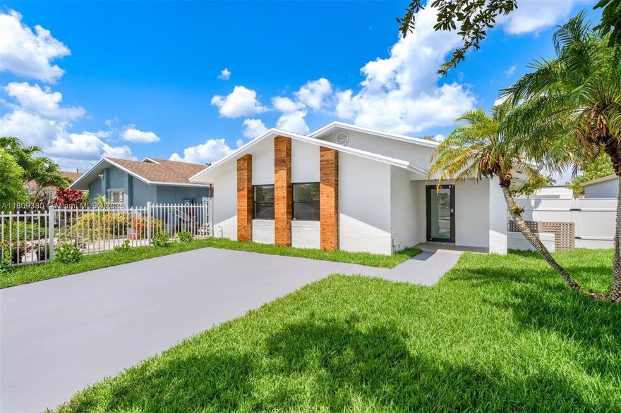 Luxury redefined in every detail — this stunning 3BD/2BA home has been gut renovated with no expense spared, featuring brand new electrical, plumbing, and AC. High-end finishes throughout include impact windows/doors, FORNO appliances, Italian cabinetry, quartz countertops, smart toilets, and designer recessed lighting with dimmers. Lush landscaping with gardening beds, sprinkler system, and elegant entrance/landscape lighting that illuminates the property at night. Enjoy a covered patio and spacious backyard—perfect for hosting gatherings, BBQs, or simply relaxing in your private oasis. A warm, sophisticated smart home offering elevated living at a still-reasonable price.