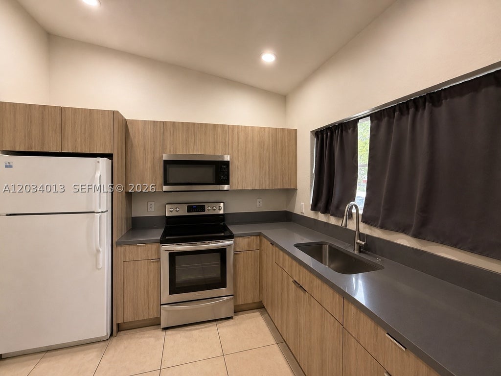 Photo of 3874 SW 48th Ave #3874, Hollywood, FL 33023 (MLS # A12034013)