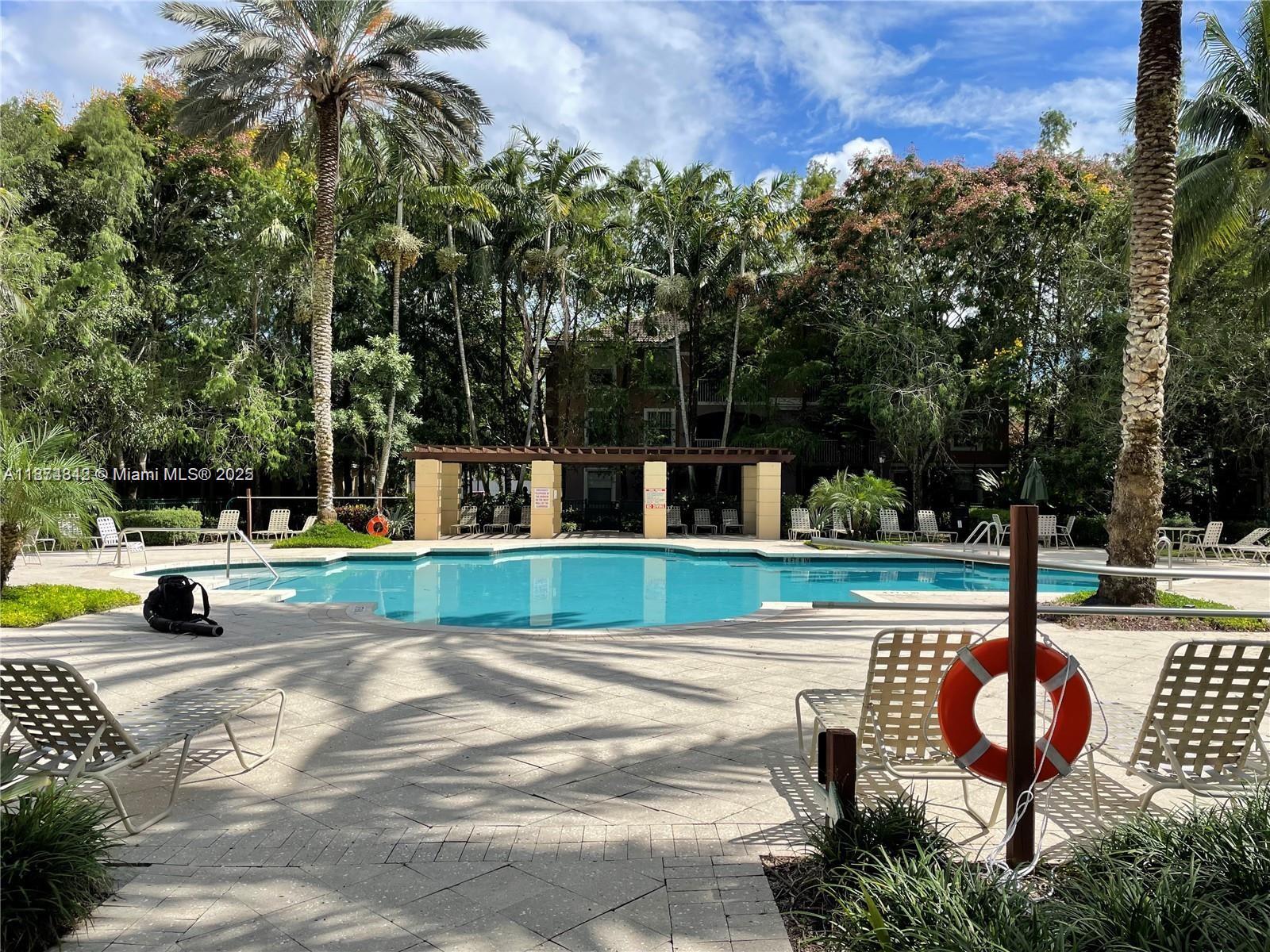 Resort-style living in gated Cypress Pointe! Bright 2BR/2.5BA two-story townhome with 1-car garage. Open living/dining, spacious kitchen with granite counters & stainless appliances, tile down and wood/laminate up, plus in-unit washer/dryer. Community features clubhouse, fitness center, oversized pool, spa, kiddie pool, business room, playground & courts. Prime location near shopping, dining, parks & major highways. Fast access to Turnpike/Sawgrass. Association approval required.