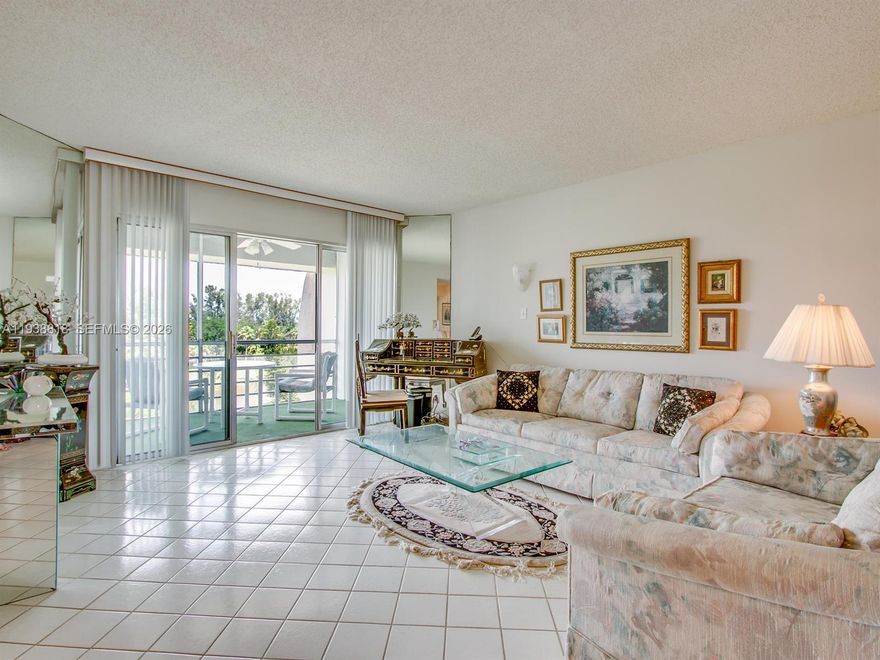 Gorgeous golf and lake views from this bright penthouse condo located in the finest building in Poinciana. A popular open floor plan has expanded views from the kitchen, living room and master bedroom that lead out to a screened patio. It has undated vanities in both bathrooms, tile floors throughout. Master bedroom has 3 closets and an on-suite bathroom. The generous guest bedroom with a spacious closet will allow your visiting guests the privacy. A full bath is steps away from it. W/D in unit. Must see this unit to appreciate the views. The subdivision has its own pool just steps away from the building. Poinciana is a very active adult community with clubhouse, restaurant, tennis, golf (no membership required), social clubs, movies, etc.