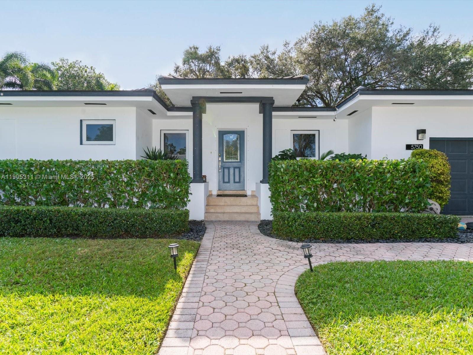This is a rare opportunity to own a private retreat in one of Miami’s most desirable neighborhoods. 3/2 single family updated home w/2-car gar on gated double lot w/2594 adj sf just steps from Coral Gables. Split floor plan, impact windows/doors, concrete tile roof, dual AC zones & newer septic system. Hardwood & porcelain floors, modern white kitchen w/quartz countertops. Spacious primary suite boasts a spa-style bath, walk-in closet & separate room with a view, ideal for office/gym. Outdoors, a tropical oasis awaits w/a lagoon-style saltwater pool, hot tub & covered veranda w/ceiling fans, all surrounded by mature landscaping & a large yard perfect for play. Separate utility/laundry. Amazing location near UMia, the Biltmore & mins from MIA, Brickell & David Fairchild Elem. NON-Flood Zone