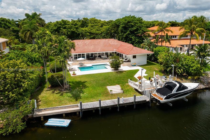 Gorgeous one-story waterfront home nestled in the prestigious gated community of Cocoplum. Living room, family room and master bedroom open to a beautiful private garden, a heated pool and the waterway. With a 1,178sf pool patio, 2 summer kitchens and direct access to the ocean. This Miami dream home has 118 feet of waterfront with 50 ft. private dock plus a 40 ft. boatlift and offers a spacious living room and family room with hurricane windows and electric drapes, a modern Italian kitchen with custom-made Italian cabinets, white stone countertops, and top-of-the-line appliances, master suite with sitting area, walk-in closet, maid’s bedroom/bath, laundry room.  This home sits on a 17,644sf lot with 7 beds, 4.5 baths and is ready to entertain boat aficionados.