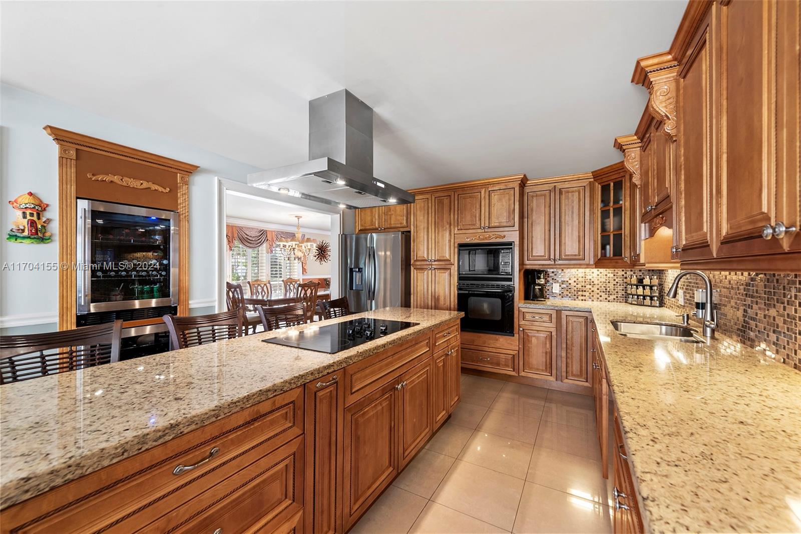 This exquisitely maintained waterfront property, located on the coveted New River in Fort Lauderdale, boasts 130 ft wide of prime river with direct deep-water access—an ideal setting for boating enthusiasts. The newly constructed dock, crafted with the finest materials, accommodates vessels up to 65 ft & offers unobstructed access to the ocean with no fixed bridges in sight. Impeccably updated with a new terracotta roof & dock, along with all necessary improvements to satisfy insurance requirements, this home is truly move-in ready. Perfectly situated just minutes from I-95, Fort Lauderdale Int. Airport & the pristine beaches, this property represents the pinnacle of comfort waterfront living. Home is currently used as a two bedroom but can be converted back to a three bedroom