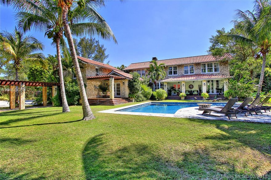 This magical Grove retreat, once the Crawford family estate, has been lovingly restored to its original grandeur! The 49,000+ sqft, lush lot creates the perfect backdrop for the coral rock home, guest hse and all its glory! Details like the 11&#x2019; wood beamed ceilings, wainscoting throughout, beautifully refinished original hdwd flrs, & fireplaces in both living & dining rooms create the true dream. Updates like all new impact windows & doors, gorgeous kitchen w/ Caesar stone counters, stainless farmhouse sink, wood cabinets to ceiling & stainless gas stove, beautifully finished bathrooms, mud room, laundry room & amazingly redone guest house w/ kitchen allow one to enjoy the modern amenities. Special features include a full basement, new roof, butler's pantry, pool, & over 40 fruit trees.