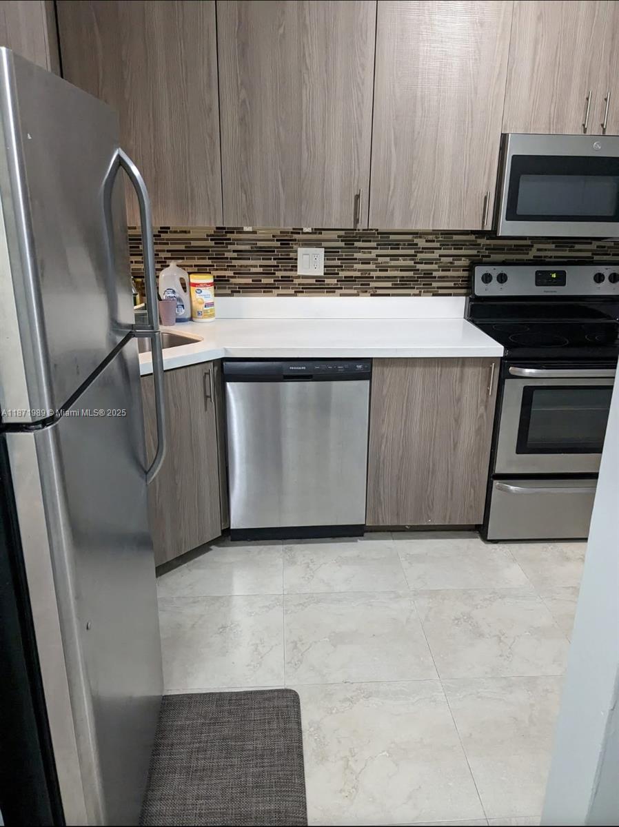 Welcome to your new home! Beautifully updated 2-bedroom 2-bathroom condo in the heart of Plantation. This spacious, bright, and airy condo, with an abundance of natural light, offers modern living in a desirable, quiet, and well-maintained Omega community. Located on the third floor, this unit features beautiful flooring throughout, fresh paint, a modern kitchen with stainless steel appliances, quartz countertops, and updated bathrooms. This condo is situated in a preferred location, offering easy access to shopping, dining, and entertainment options. With easy access to major highways, you'll have a quick commute to anywhere you need to be. This will not last!!!