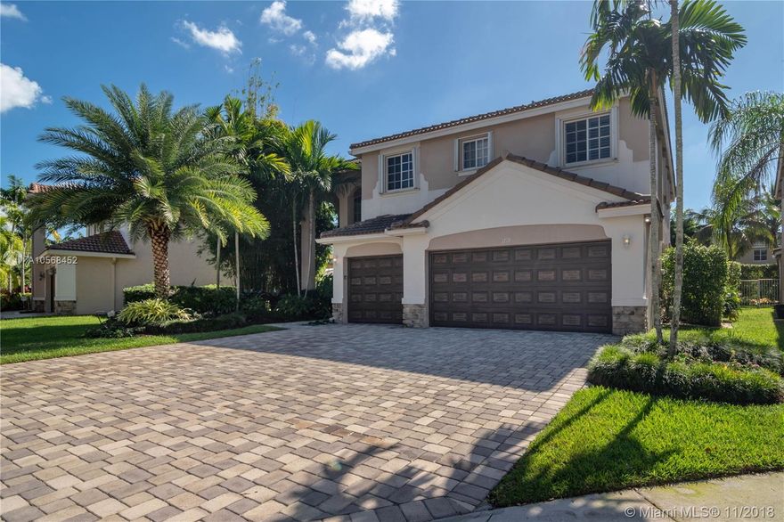 Truly Remarkable! As soon as you drive up to this gorgeous 6 bedroom 4 full bath 3 car garage home you will want to move in! The curb appeal is stunning! Professionally landscaped and stone front is just the beginning. Home is set on a quiet cul de sac with a rare extended paved driveway. The magnificent wood and rod iron staircase welcomes you in to this home with volume ceilings. This beautiful home has just been freshly painted. All 4 full bathrooms have been tastefully upgraded. Bamboo flooring in the master bedroom with warm modern bedroom furniture built in storage space. You won't change a thing! The 6th bedroom off the master is perfect for an office or custom closet space. 2 nests, solar & electric pool, extended roof & outdoor patio w/ sunshades. Just Breathtaking! Easy to show!