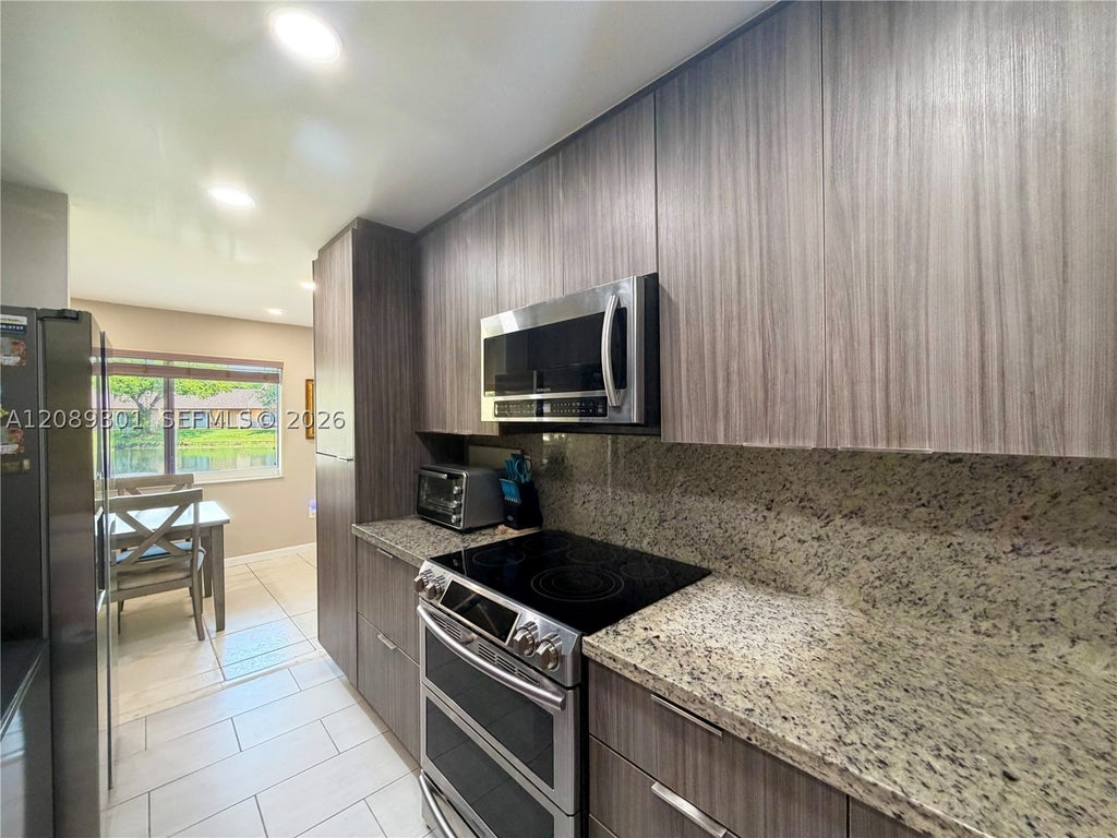Photo of 10875 NW 29th Mnr, Sunrise, FL 33322 (MLS # A12089301)