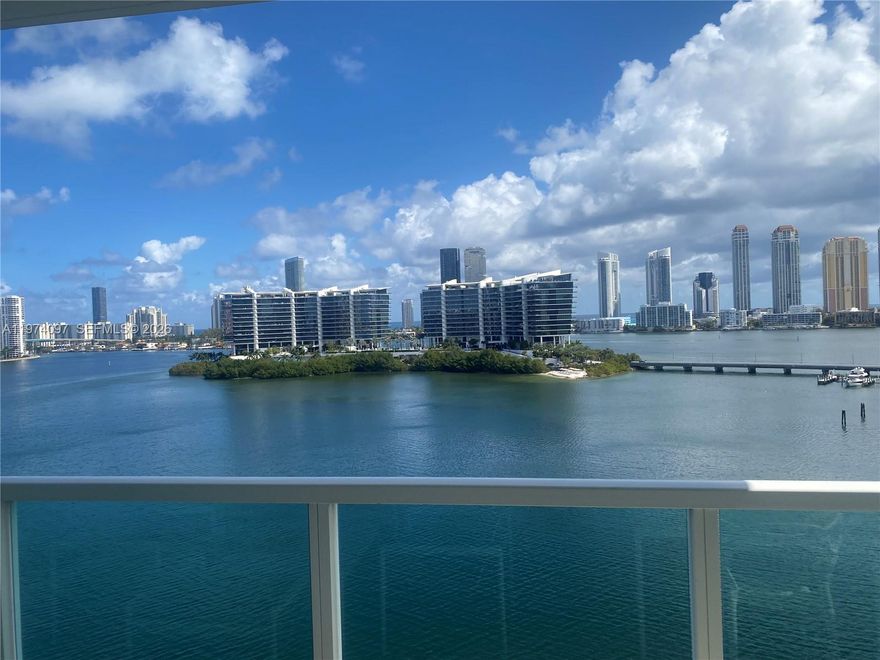 This lovely luxury waterfront residence at The Peninsula showcases breathtaking intracoastal views and refined living at its finest. Enter directly into your private foyer through elegant double doors creating an immediate sense of exclusivity. Spanning over 2,900 sf, this expansive residence features a spacious den perfect for a media room, office or add'l lounge area.  The principal suite is generously sized w/a private suite is generously sized with a private sitting area, rich wood flooring, oversized closets, and a large principal bath with a sep. shower and tub. The second bedroom is equally spacious.  The well appointed kitchen is exceptionally spacious and offers multiple layouts with the add'l space for a den or a formal dining area.  Exceptional services include a concierge, fabulous staff, 2 resort pools and hottubs, barbecue areas, a basketball area, 2 playrooms for diff. ages, multi purpose rooms, comp. daily coffee, tennis & pickleball, a dog park, and much more.  Resort living at its finest!!