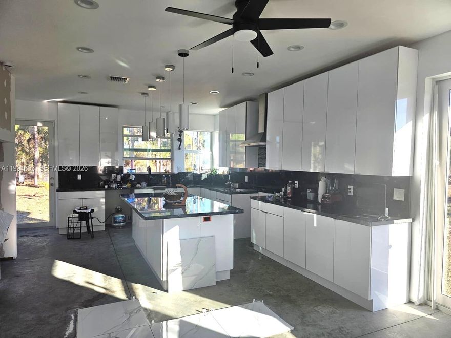 Under Construction | 3 Bed / 2 Bath | 2,140 Sq Ft | 1.25 Acres
Stunning brand-new construction featuring a hurricane-resistant structure with an oversized foundation, designed for durability and long-term peace of mind. This thoughtfully built home offers high ceilings, impact-resistant windows and doors, and a modern, energy-efficient smart HVAC system (Comfort Star).
The property includes spray foam roof insulation and R-1 rated insulation, ensuring superior energy efficiency. Interior highlights feature a spacious laundry room, attic space (14x8), and additional storage (8x8).
Enjoy luxury and convenience with two Jacuzzi units, a fully installed camera surveillance system with 45-day recording capacity, a brand-new well with a salt softener, and a new septic system.
The entire property is enclosed with an 8-foot heavy-duty fence, offering privacy and security. The land is beautifully enhanced with over $25,000 in mature fruit and coconut trees, all supported by a drip irrigation system. Conveniently located just 15 minutes from Clewiston, with easy access to Fort Lauderdale, West Palm Beach, Fort Myers, and Miami.