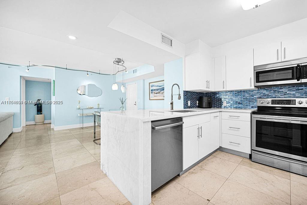 Luxury annual furnished rental, 3 bedrooms 2 bathrooms residence at The Mark features a fully renovated kitchen with quartz countertops. Impact windows. Two balconies. Water and internet included in the rent. Resort style amenities including pool, jacuzzi, sauna, gym, tennis court, BBQ area, etc. Two parking spaces, one assigned on unit's floor and one complementary valet. First, last and security to move in.