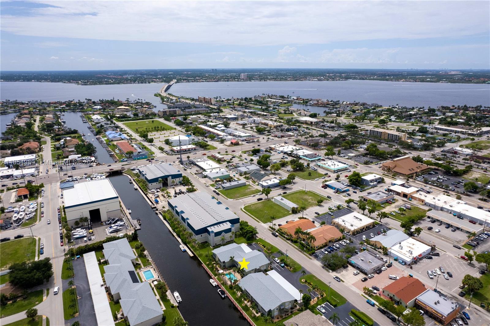 FIRST TIME ON MARKET IN 25+ YEARS! Live the FLORIDA DREAM at MARINA 46 – a RARE 1st-floor CORNER Gulf-access condo in SE Cape Coral! This 2BR/2BA boasts the largest floorplan, open design, & bright natural light. STUNNING UPDATES: modern tile, re-piped plumbing, new electrical panel, remodeled granite baths w/ ADA shower, newer A/C & water heater, stainless fridge, hurricane-impact glass, & lanai w/ breathtaking POOL & INTERSECTING CANAL VIEWS! Community POOL, BOAT SLIPS, storage, & covered parking included. Just ONE BRIDGE to the Caloosahatchee & Gulf – a BOATER’S PARADISE! Minutes to Sanibel, Captiva, Fort Myers Beach, Naples & more. A RARE GEM – ACT FAST!