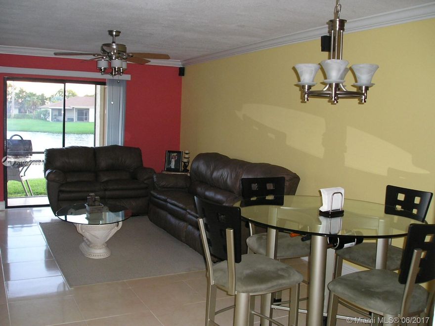 OPEN AND AIRY, THREE BEDROOM, TWO BATH VILLA IN SUNRISE WON’T LAST!  RENOVATED KITCHEN WITH GRANITE COUNTERS AND NEWER CABINETS WITH LOTS OF SPACE INCLUDING A WINE RACK. SPLIT BEDROOMS – MASTER SUITE WITH WALK IN CLOSET, UPDATED BATHROOM.  SPACIOIUS 2ND AND 3RD BEDROOMS WITH REMODELED BATHROOM FEATURING SHOWER TUB COMBO.  FULL SIZE WASHER AND DRYER TILE THROUGHOUT AND CROWN MOLDING IN LIVING AREAS. OPEN PATIO FOR WEEKEND BARBEQUES AND SOOTHING VIEW OF LAKE.  CORNER UNIT WITH PLENTY OF NATURAL SUNSHINE!  TWO PLUS PARKING SPACES, COMMUNITY POOL AND LOW HOA FEES!   DON’T THINK ABOUT THIS ONE TOO LONG!!