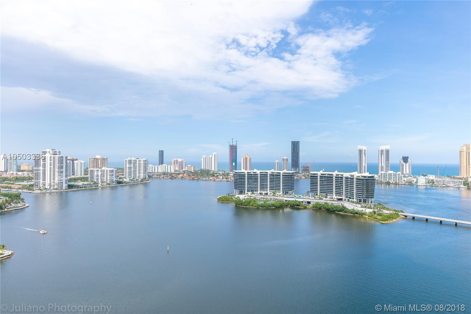 SPECTACULAR PENTHOUSE UNIT WITH DIRECT INTRACOASTAL AND OCEAN VIEWS!!! 2 BED 2.5 BATH WITH ENCLOSED DEN COULD BE 3RD BEDROOM. FRESHLY PAINTED WITH LARGE TERRACE, FLOOR TO CEILING WINDOWS, MARBLE FLOORS AND WOOD IN THE BEDROOMS. ELECTRIC WINDOW TREAMENTS AND BLACKOUT SHADES. THIS UNIT COMES WITH TWO COVERED PARKING SPACES. THIS PROPERTY IS BEING OFFERED UNFURNISHED. ENJOY ALL THE WONDERFUL AMENITIES PENINSULA II HAS TO OFFER INCLUDING FULL SERVICE CAFE WITH POOLSIDE SERVICE, SPA, 2 POOLS, 2 GYMS, TENNIS COURTS, VALET & CONCIERGE. WALKING DISTANCE TO, RESTAURANTS, PARKS, HOUSES OF WORSHIP AND JUST MINUTES FROM AVENTURA MALL & THE BEACH. OWNER IS READY FOR A LONG TERM TENANT! NO SHORT TERM RENTALS.