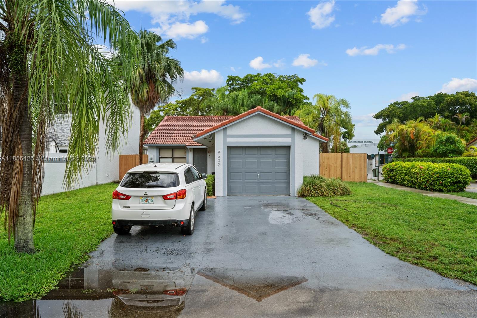 Beautifully remodeled 3-bedroom, 2-bath home in the desirable Hammocks community. Featuring 1,472 sq ft of living space on a 5,022 sq ft corner lot with only one neighbor, this home offers modern finishes, porcelain tile floors, updated kitchen and baths, and a bright open layout. Enjoy a fenced backyard perfect for relaxation or entertaining, plus a 1-car garage and driveway parking. Located near major highways, shopping, hospitals, and top-rated schools (Oliver Hoover Elementary, Hammocks Middle, Felix Varela High). Community amenities and HOA $320/month. Move-in ready and ideal for those seeking comfort, style, and an excellent location in Miami.