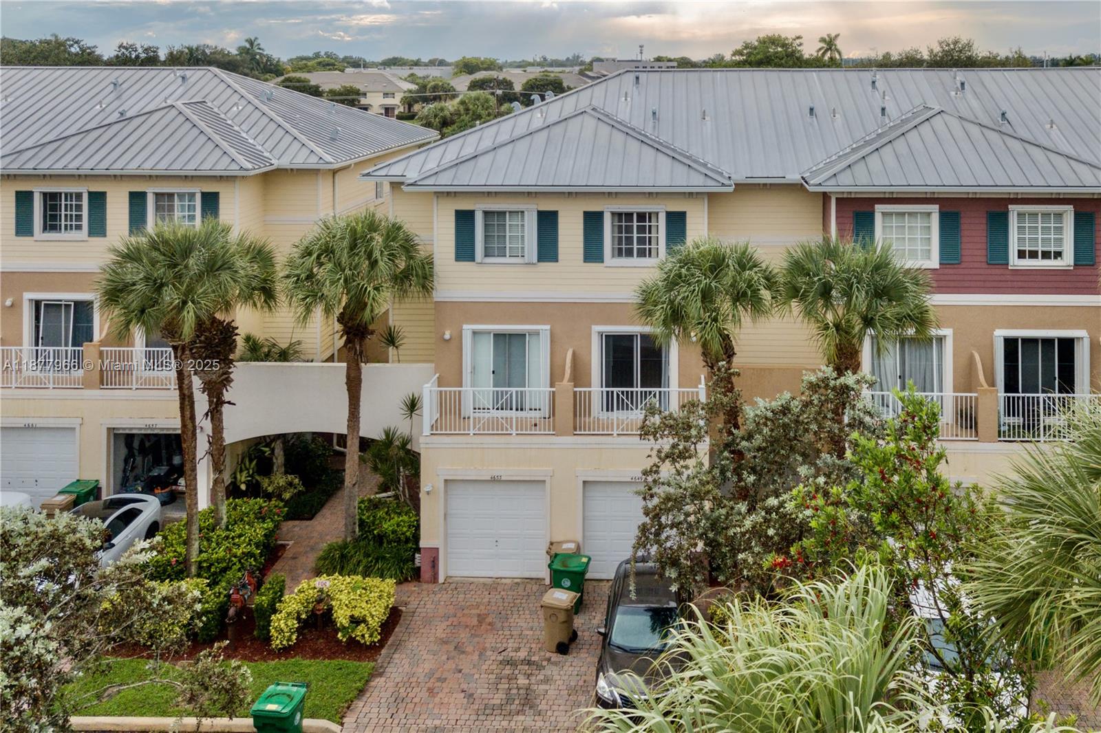 This spacious 3-story townhouse features a welcoming first-floor entry with an open-concept kitchen, dining, and living area, a half bath and patio overlooking the canal and garden. The updated kitchen boasts wood cabinetry, quartz countertops, and stainless-steel appliances. The combined living and dining area opens through French doors to the private patio. Upstairs, the second floor offers a generous master suite with a balcony, two walk-in closets, and a large bath with dual sinks, a Jacuzzi tub, and a separate water closet. The third floor includes a laundry room with washer/dryer and two additional bedrooms, each with walk-in closets and private balconies. A one-car garage provides extra convenience.