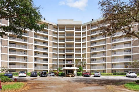Photo of 3090 N Course Dr #807, Pompano Beach, FL 33069 (MLS # A12059714)