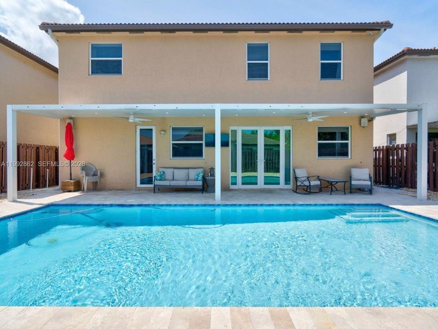 Beautiful and spacious 5-bedroom, 4-bathroom smart home located in the desirable Hemingway Point community. This newer construction home is equipped with smart technology throughout, offering modern convenience and efficiency. The property features an extended driveway providing ample parking, hurricane-resistant back doors for added protection, and a private backyard designed for South Florida living with a heated swimming pool and low-maintenance artificial turf, perfect for entertaining year-round. Inside, the home offers a bright and open floor plan, generous living areas, and a 2-car garage. Conveniently located near major highways, shopping, dining, and schools.