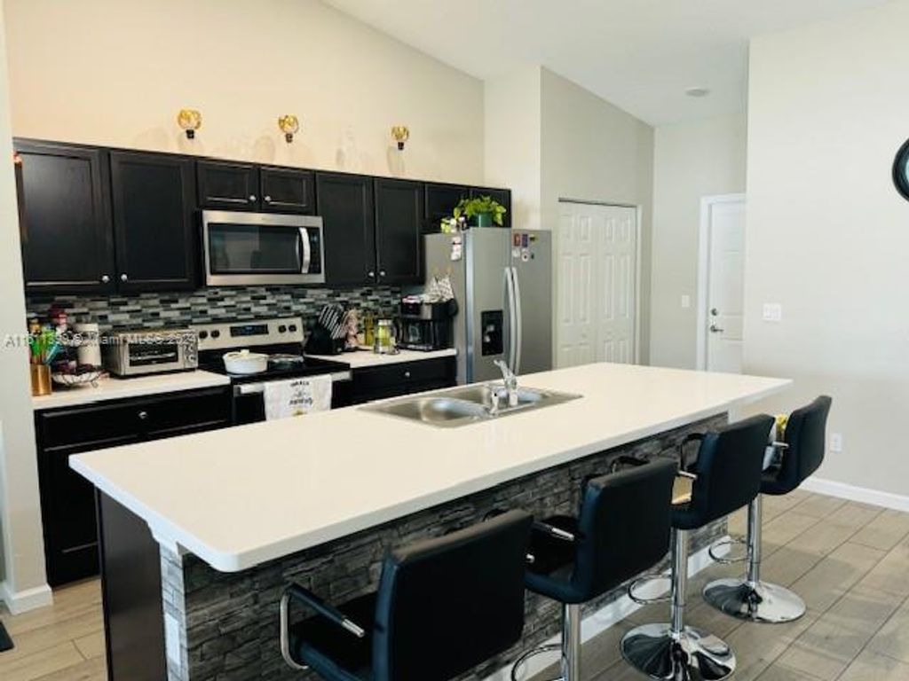 Photo of 4612 SW Paley Rd, Port Saint Lucie, FL 34953 (MLS # A11611399)