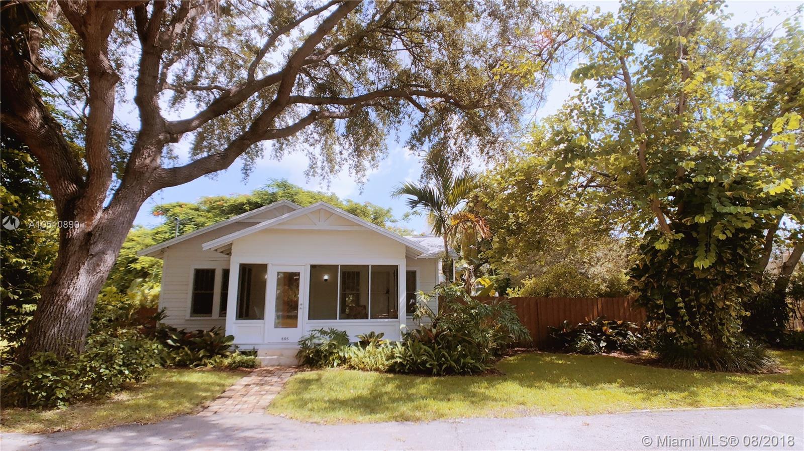Move to this charming, cozy, and lovely house in the Biscayne Park neighborhood, nestled in a lot of approx. 8,600 Sq Ft with gorgeous tropical plants surrounding the house and an inviting and well maintained swimming pool. House is located on a cul de sac with very minimum traffic. This house features 2 bedrooms and 1.5 bathrooms, library/den, dining/living room with built in library shelves, charming living room with chimney, spacious porch entrance, new A/C unit for better energy consumption has been installed There is an outdoor shower, and plenty of outdoor space for your enjoyment with total privacy. Small dog ok. Landscaping and pool service included in rent. Don't miss this opportunity. Outdoor lovers' dream.