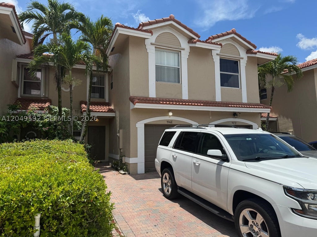 Photo of 9064 NW 54th St #9064, Sunrise, FL 33351 (MLS # A12049592)