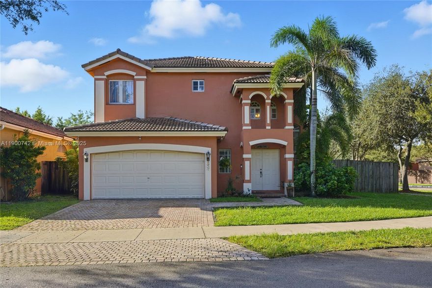 Beautiful 2-story home with stunning lake view! Enjoy a spacious backyard with mango & plantain trees and an in-ground pool, all with the added privacy of being a corner home. Upstairs, the master suite is a true retreat, with a master bath featuring a relaxing Roman tub, and complete with a walk-in closet for her, separate closet for him. 2 additional bedrooms share a full bath. Elegant laminated wood flooring graces the staircase & second floor, while tile adds durability and style downstairs. The kitchen boasts a sleek peninsula design that opens to the cozy family room with direct access to the backyard. Open living, dining & foyer areas, complemented by a convenient 1/2 bath & laundry area. Just a minute away from Mayor Roscoe Park, & across the street from the associations own park.