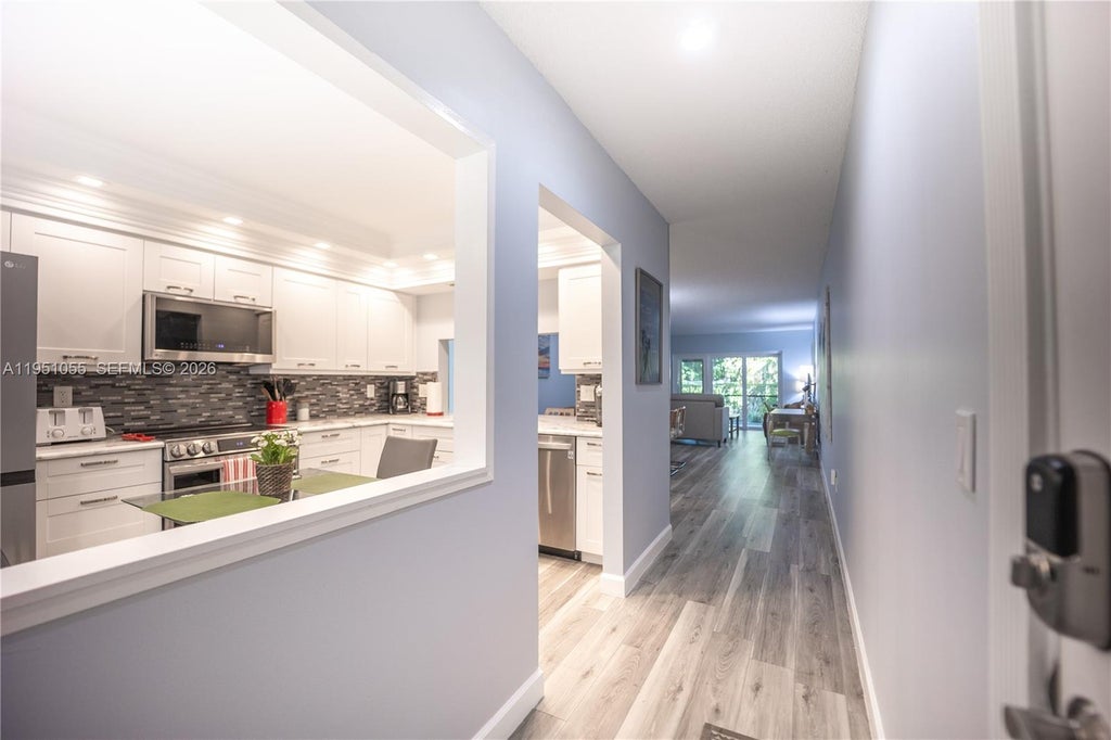 Photo of 4000 Crystal Lake Dr #114, Deerfield Beach, FL 33064 (MLS # A11951055)