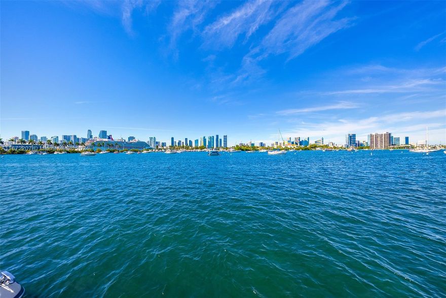 Experience the chance to build your dream home or update the current 2-story waterfront residence on Palm Island’s sought-after western tip, showcasing panoramic views of the Miami skyline and Biscayne Bay. The home features travertine and original wood floors, a spacious family room, and an open living area with direct access to the pool deck. The open kitchen offers a center island and an adjacent dining area. The 2nd-floor primary suite includes custom closets and a lounge area overlooking the city and bay. Outdoors, enjoy a heated pool, seating areas, and covered porch. Boaters will appreciate 78’ of waterfront, private dock, and easy ocean access.