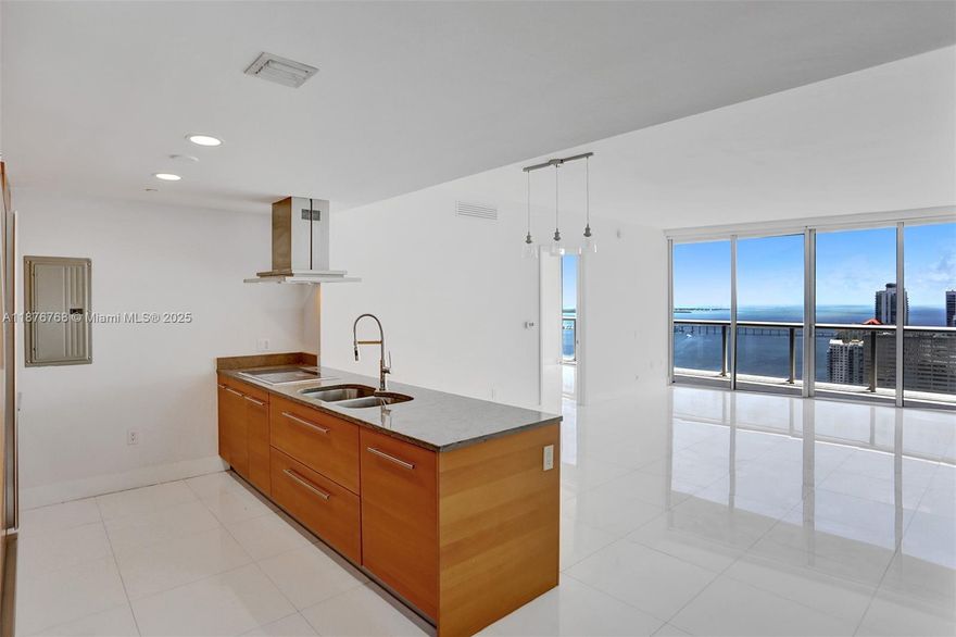 Stunning Biscayne Bay views at Icon Brickell. Beautiful two bedrooms, two bathrooms, and a den. Spacious living area. The unit is unfurnished, with built-out closets, electric blackouts, and sheer curtains in bedrooms. Resort-style amenities include a swimming pool, spa, state-of-the-art gymnasium, self-parking, and valet. NEW Sub-Zero refrigerator, Wolf kitchen appliances. See Broker's Remarks.