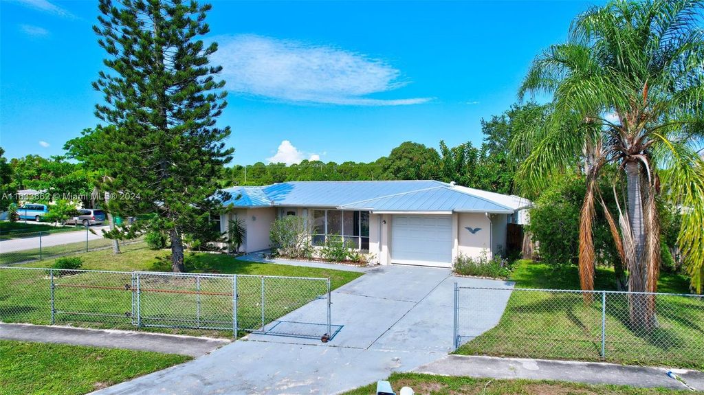 Photo of 216 NE Mainsail St, Port Saint Lucie, FL 34983 (MLS # A11633662)