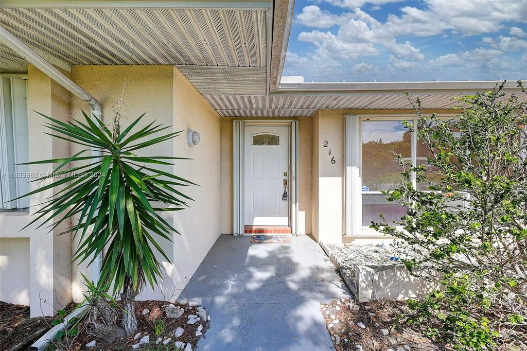 Photo of 216 NE Mainsail St, Port Saint Lucie, FL 34983 (MLS # A11633662)