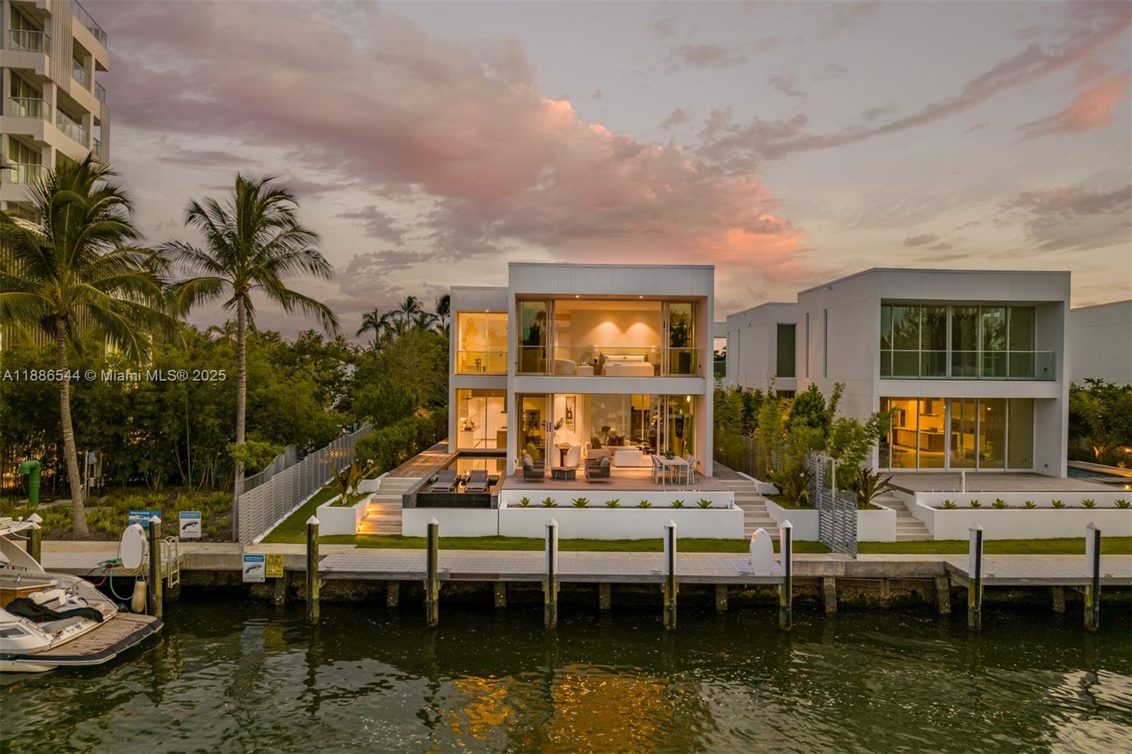 Indulge in waterfront luxury at The Ritz-Carlton Residences. One of only eight exclusive two-story villas by Piero Lissoni, this rare home embodies tropical modern elegance with a neutral palette, soaring ceilings, and walls of glass that frame breathtaking water views. Boasting 55 feet of prime frontage on Surprise Lake with direct access to Biscayne Bay, the Intracoastal, and the Atlantic Ocean, this villa seamlessly blends privacy with resort-style living. Experience a lifestyle of distinction with the five-star amenities, personalized services, and world-class sophistication that only The Ritz-Carlton can provide, an unmatched retreat where exclusivity meets the pinnacle of South Florida luxury.