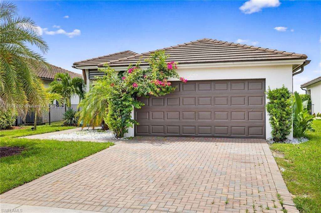 This gorgeous 3/2.5 Birch model embraces the Florida lifestyle with an open floor plan and abundant natural light. The living area highlights a custom entertainment wall with wood details and built-ins. The kitchen flows seamlessly into dining and living—perfect for daily living or entertaining. The master retreat offers dual vanities and a glass-enclosed shower. Outside, enjoy lush landscaping and a paver driveway. Maple Ridge residents access The Club with pool, gym, sauna, party room, dog park, billiards, and more—plus town amenities like a waterpark, paths, sports courts, shopping, and dining.