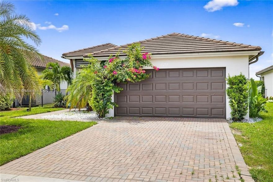 This gorgeous 3/2.5 Birch model embraces the Florida lifestyle with an open floor plan and abundant natural light. The living area highlights a custom entertainment wall with wood details and built-ins. The kitchen flows seamlessly into dining and living—perfect for daily living or entertaining. The master retreat offers dual vanities and a glass-enclosed shower. Outside, enjoy lush landscaping and a paver driveway. Maple Ridge residents access The Club with pool, gym, sauna, party room, dog park, billiards, and more—plus town amenities like a waterpark, paths, sports courts, shopping, and dining.