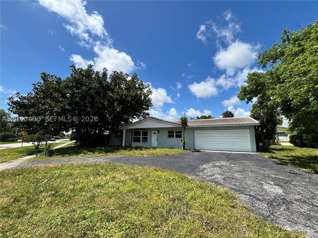 Photo of 4300 NW 9th Ct, Coconut Creek, FL 33066 (MLS # A12040490)
