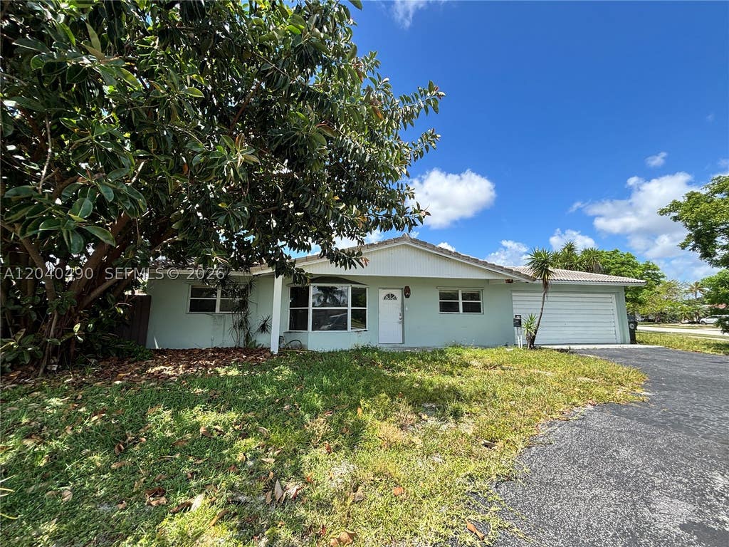 Photo of 4300 NW 9th Ct, Coconut Creek, FL 33066 (MLS # A12040490)