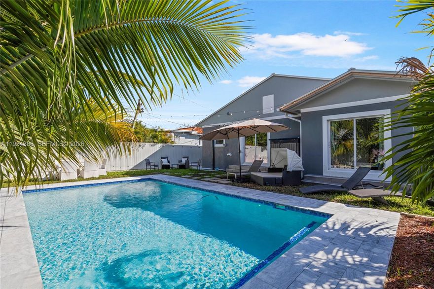 This modern home was completely remodeled in 2020. Updates include new tile flooring throughout, a fully upgraded plumbing system, a new electrical panel with updated interior and exterior wiring, dimmable LED lighting, and four new 12,000 BTU split A/C units for year-round comfort. The kitchen was also updated in 2020 with all-new appliances, cabinetry, and countertops, and it opens directly to the backyard, creating a seamless flow for indoor-outdoor living. Step outside to a beautifully designed pool and outdoor space ideal for entertaining, relaxing, or everyday enjoyment. The primary suite offers direct access to the pool, enhancing the home’s private, resort-style feel. The home includes two full bathrooms with spacious showers and bidets, plus a convenient half bath for guests. The second bedroom features its own private entrance, offering flexibility for rental income, guests, or a home office. A new metal roof installed in 2025 completes the property, providing long-term durability and peace of mind.