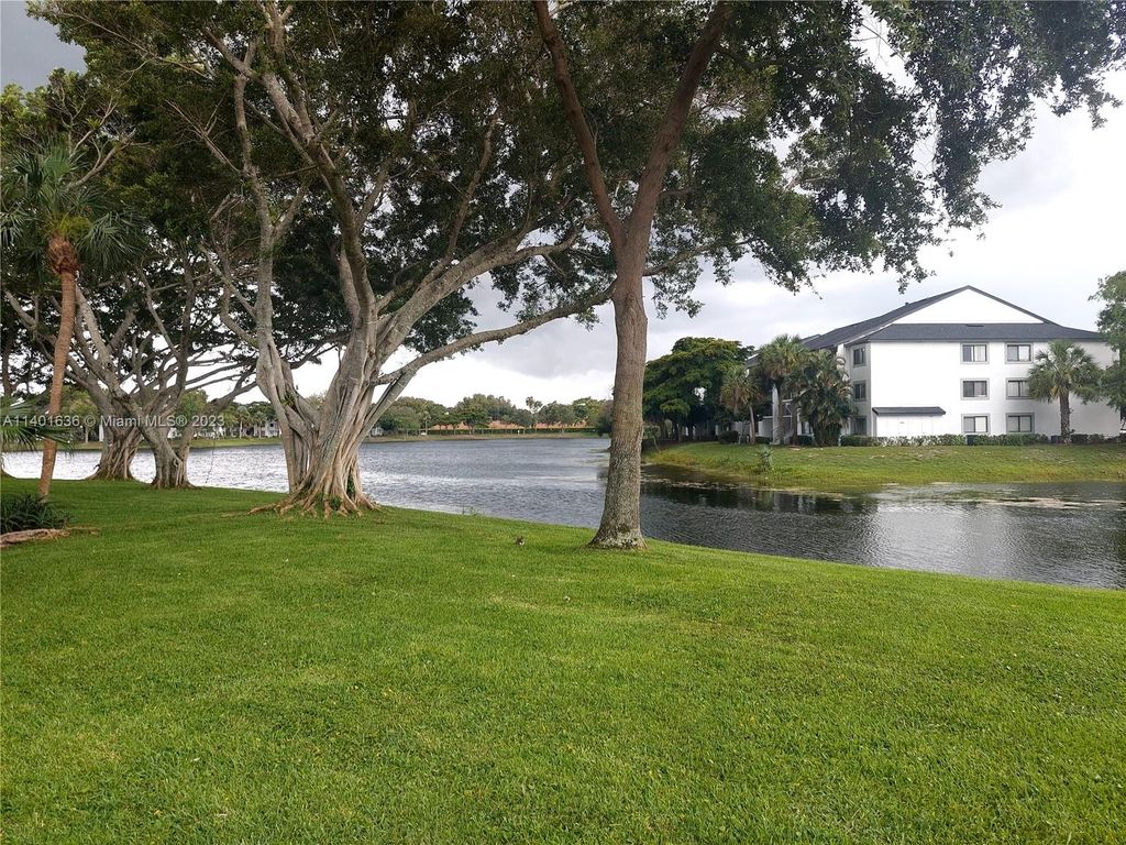 Photo of 5400 Cedar Lake Dr #201, Boynton Beach, FL 33437 (MLS # A11401636)