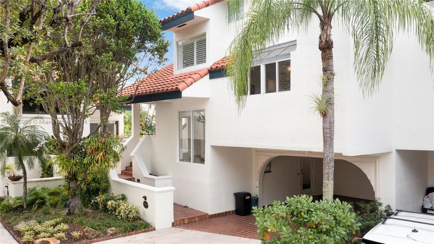 Beautiful corner tri-level villa, nestled in the secure and tranquil community of L'Hermitage in Coconut Grove, offering a great view of the pool. It's conveniently located opposite Ransom Everglades Middle School. The villa's thoughtful layout includes two bedrooms on the top floor, each with an ensuite, and two additional bedrooms on the ground floor.  The master bedroom has its own balcony and study.  Recent renovations enhance the villa's appeal, featuring a new kitchen (2018), modern impact windows, a new roof in 2014, a new kitchen and a comprehensive renovation of the first floor in 2018. This is a quiet neighborhood on Biscayne Bay with 15 boat spaces and two clay tennis courts in one of the most desirable area in the Grove, minutes from Brickell, the airport and Kennedy park.